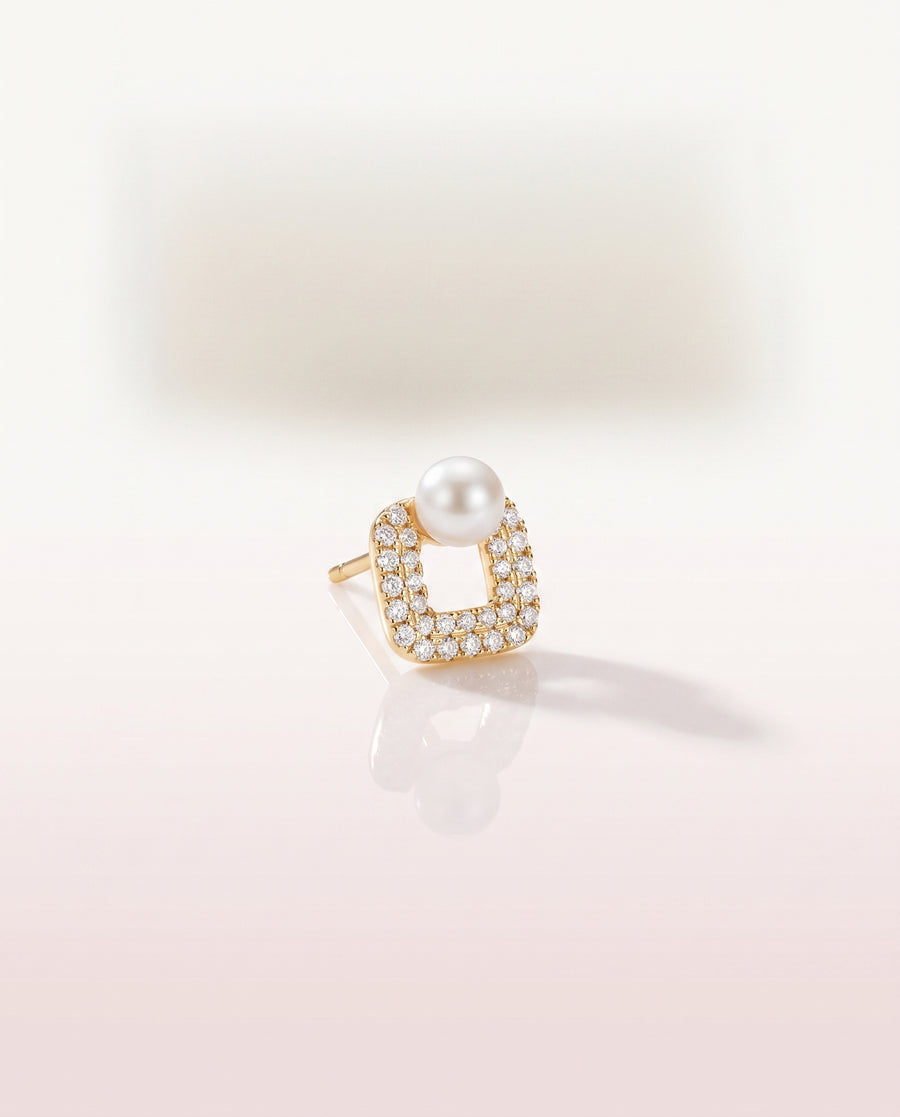 Square Pave Pearl Studs freshwater pearl earring on a glossy pedestal