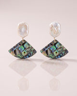 Abalone Shell Fan Drops freshwater pearl earring on a glossy pedestal