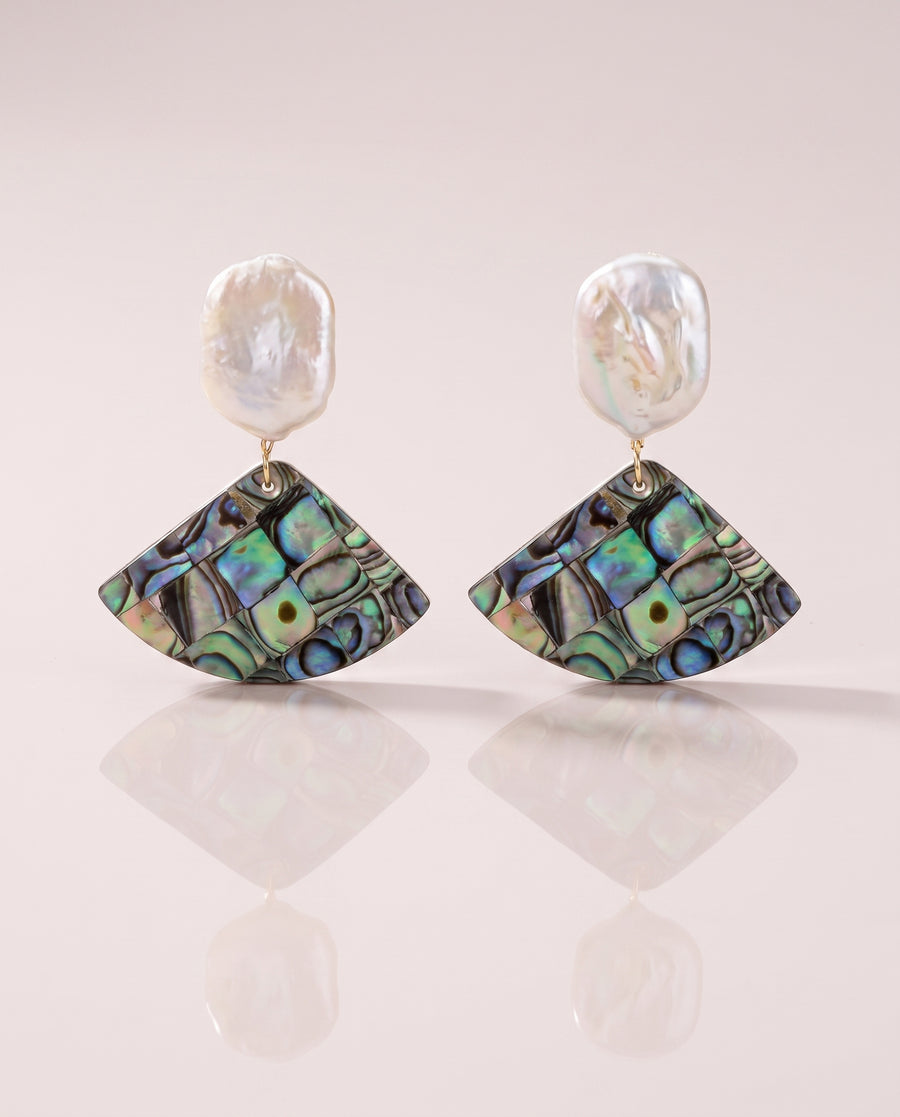 Abalone Shell Fan Drops freshwater pearl earring on a glossy pedestal