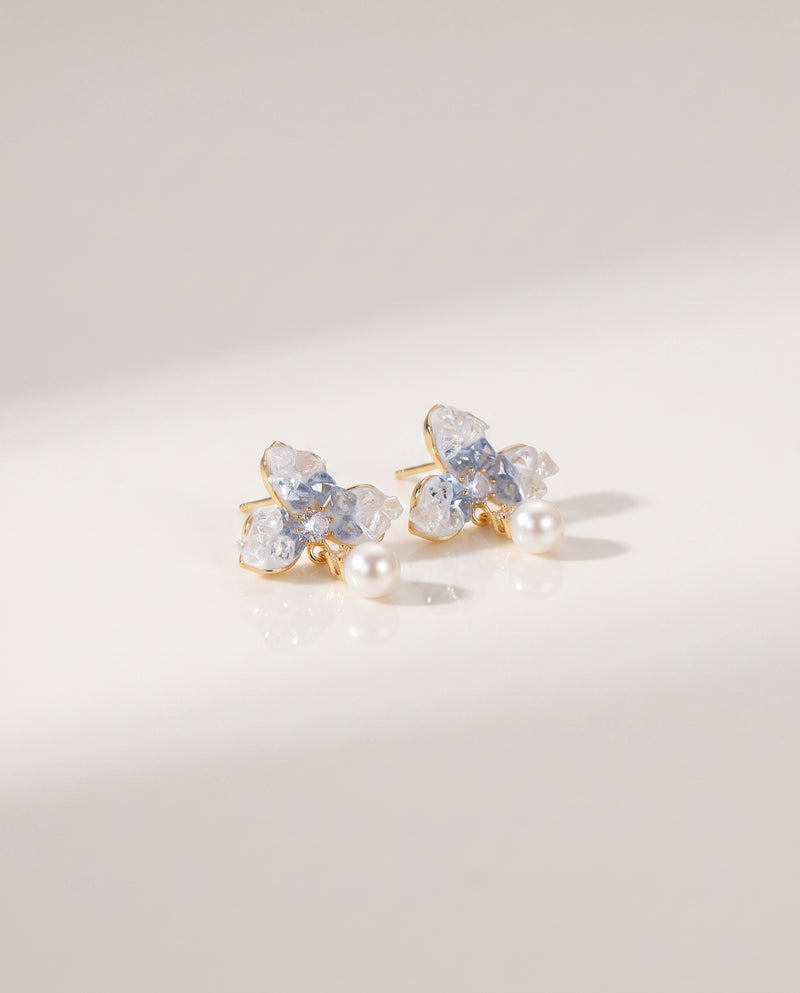 Blue Petal Pearl Studs freshwater pearl earring on a glossy pedestal