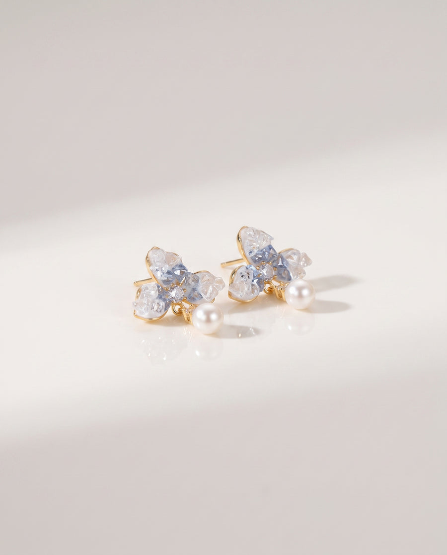 Blue Petal Pearl Studs freshwater pearl earring on a glossy pedestal