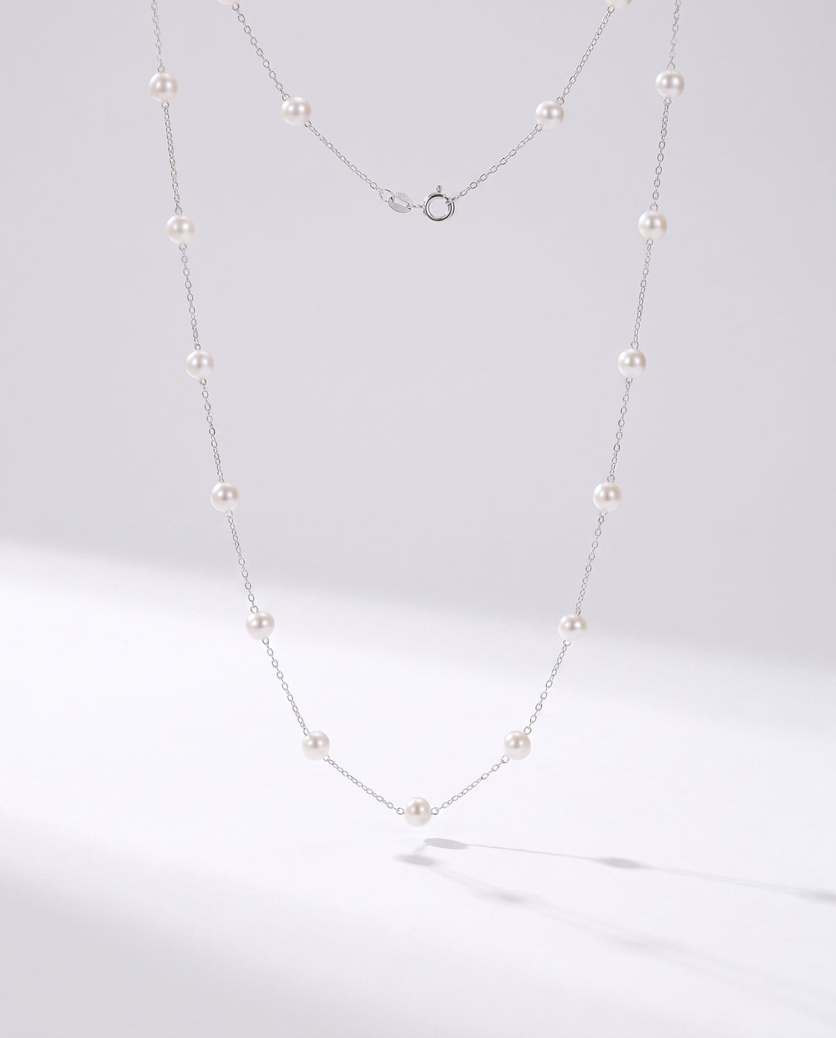 Pearl Station Necklace freshwater pearl necklace on a clean white background
