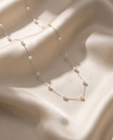 Pearl Station Necklace freshwater pearl necklace draped on champagne silk