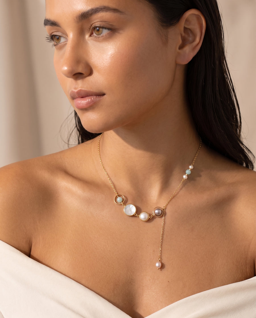 Aquamarine Pearl Lariat Necklace worn by a model, editorial half turn
