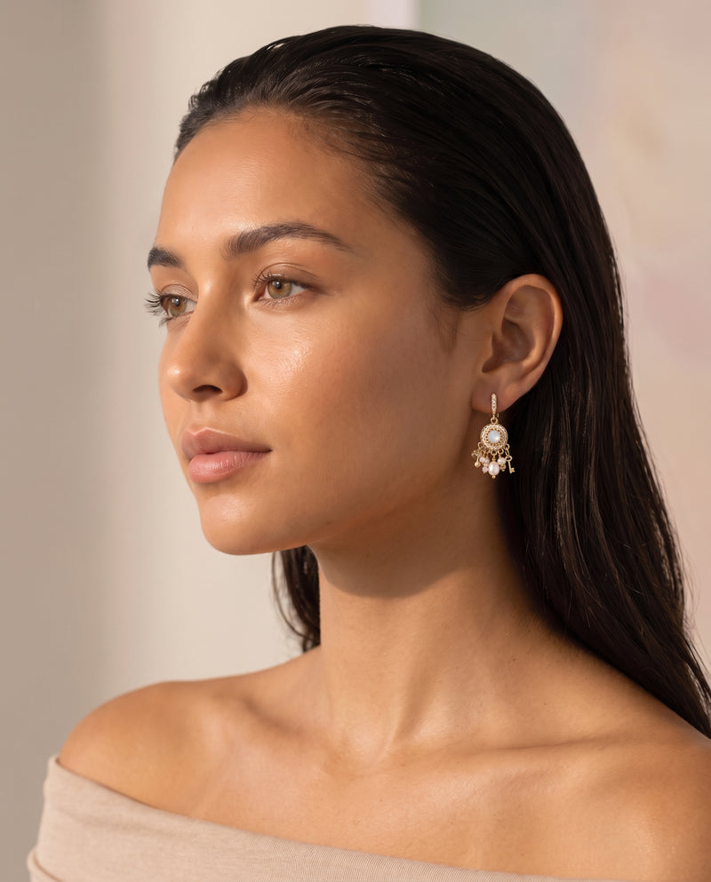 Vintage Medallion Pearl Drops worn by a model, three-quarter view