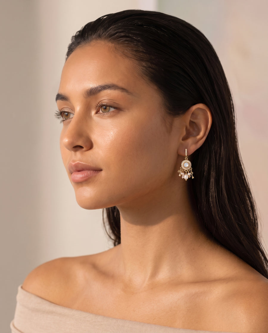 Vintage Medallion Pearl Drops worn by a model, three-quarter view