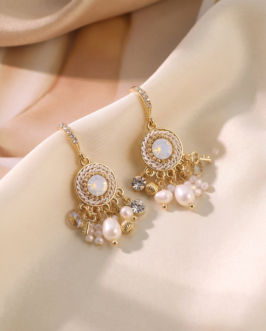 Vintage Medallion Pearl Drops draped on champagne silk