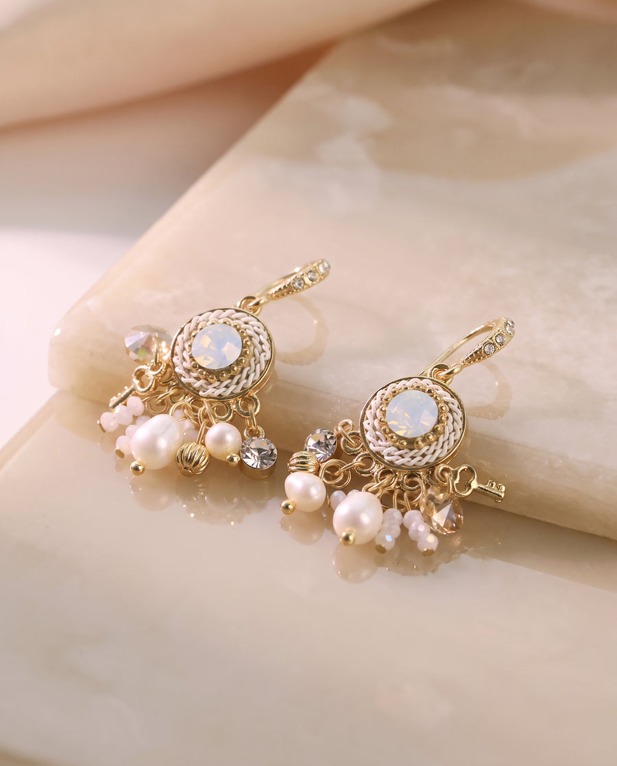 Vintage Medallion Pearl Drops on a glossy pedestal